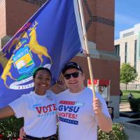 Student senate and student hold Michigan sign
